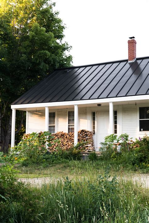 white farmhouse with metal roof